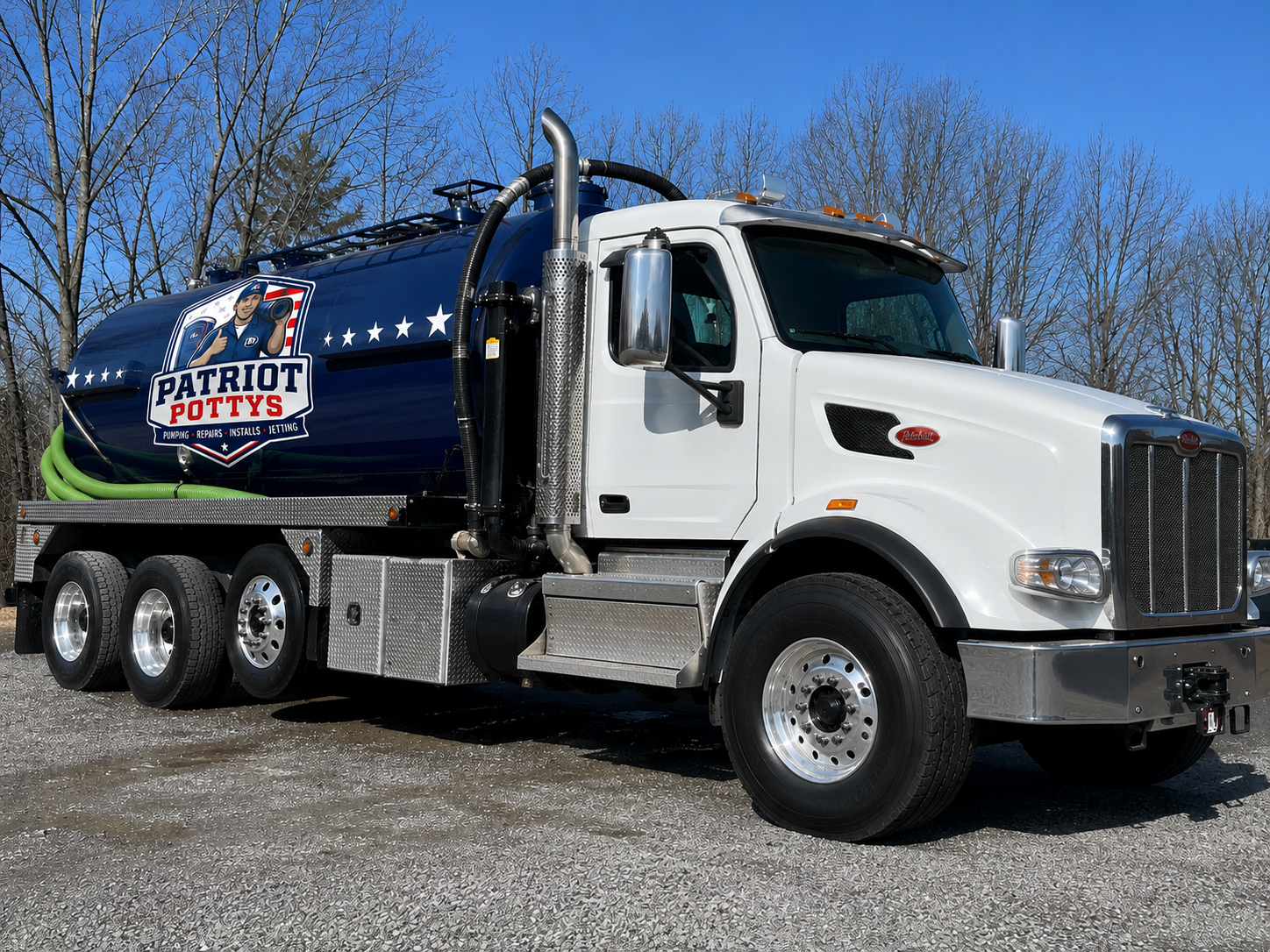 Patriot Pottys vacuum pump truck — branded blue tank Peterbilt